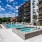 swimming pool with spacious seating areas and reclining chairs