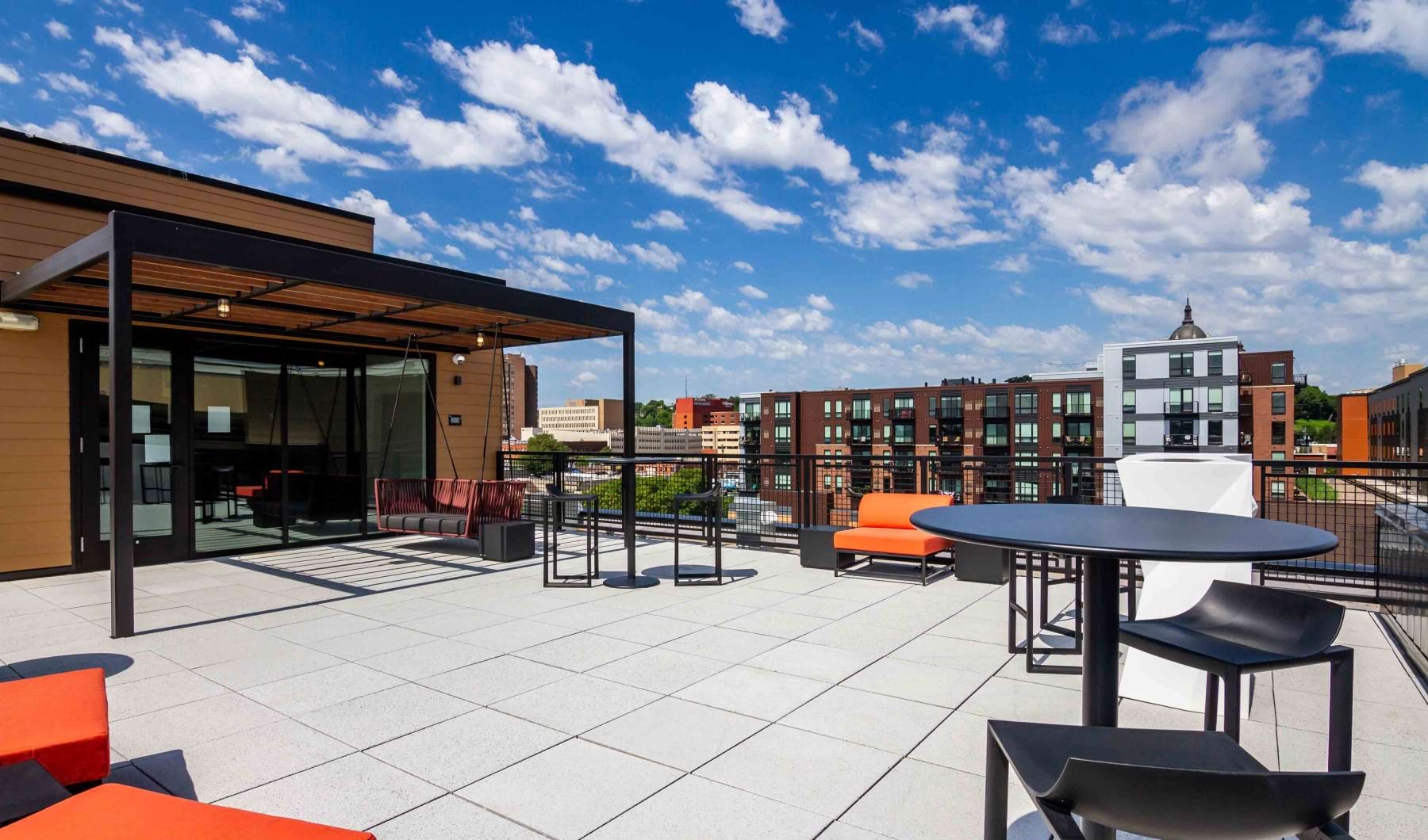 Rooftop deck with lounge spaces and city views at Irvine Exchange Apartments for rent in St. Paul Rooftop deck with lounge spaces and city views at Irvine Exchange Apartments for rent in St. Paul