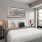 well lit bedroom with large windows